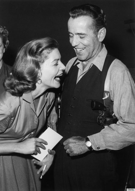 Lauren Bacall laughing with Humphrey Bogart