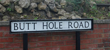 Butt Hole Road sign
